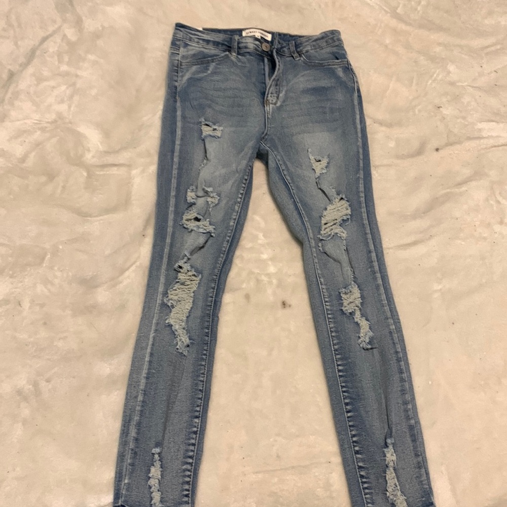 High waisted ripped blue jeans